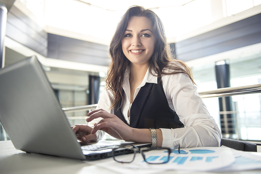 Woman working on a BBA degree at her laptop